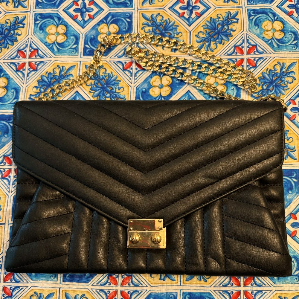 Like new. Good condition. Express. Large shoulder bag. Black. Faux Leather.